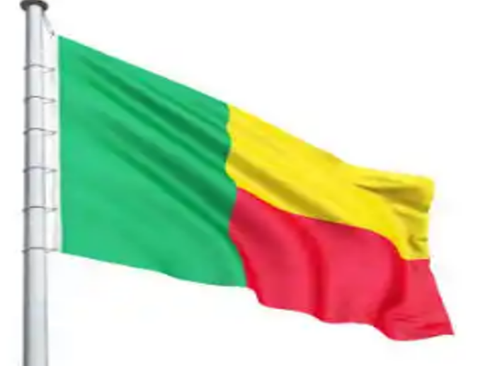 A green yellow and red flag flying in the wind