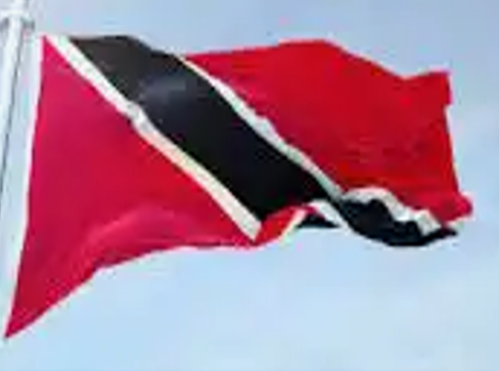 A red and black flag flying in the sky.