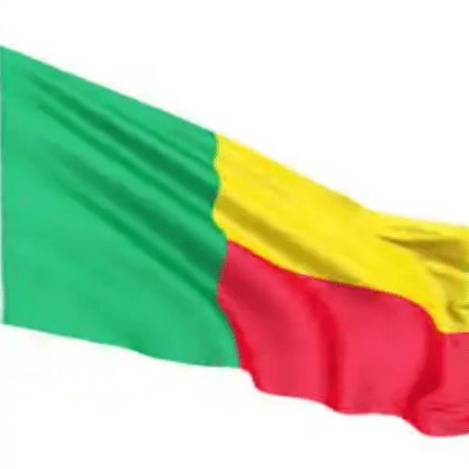 A green yellow and red flag flying in the wind