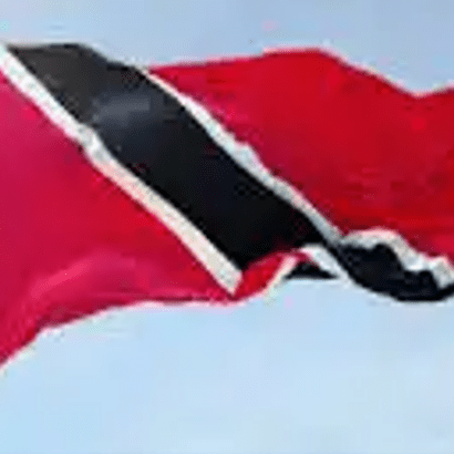 A red and black flag flying in the sky.