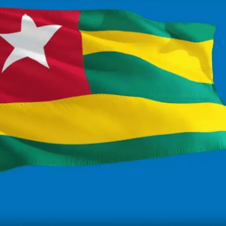 A flag of togo is waving in the wind.